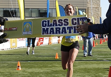 CTY marathon27p   Samantha Bluske, of Toledo, is the first female finisher of the marathon.    The Glass City Marathon in Toledo, Ohio on April 25, 2015. The events include a marathon, a 5 Person Marathon Relay, a half marathon, and a 5K.   The Blade/Jetta Fraser